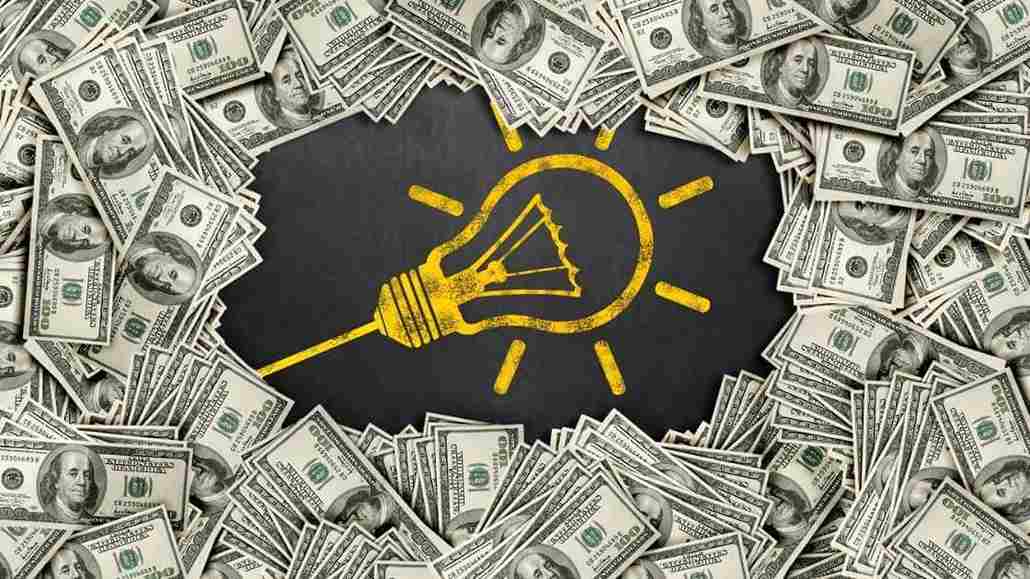 Rising electric costs in Florida shown with lightbulb and money