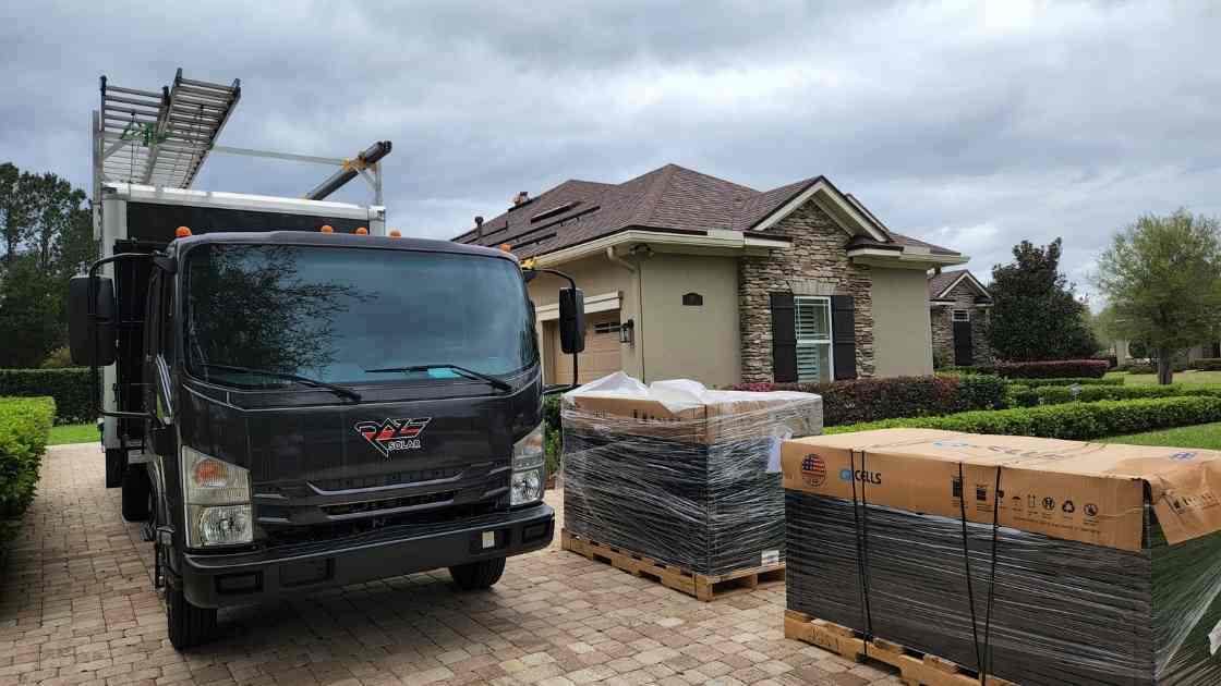 solar panel installer outside Florida home unloading solar panel materials