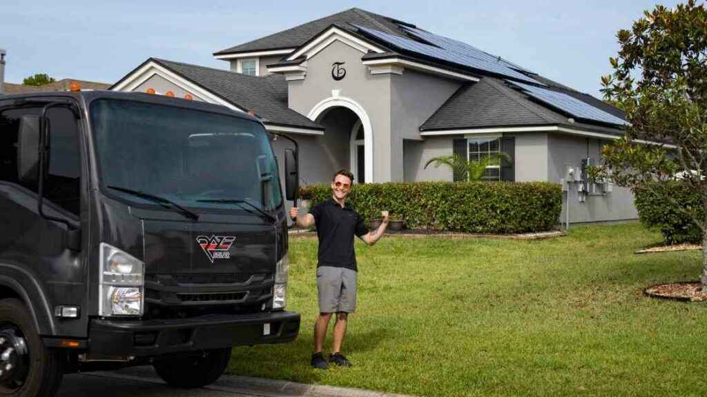 solar panel contractor removing rooftop solar panels to move them to new home