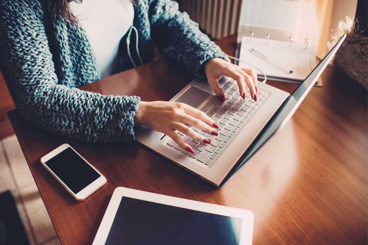 woman on computer updating home insurance for solar panels