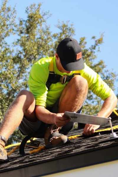 Florida solar installer on roof of home