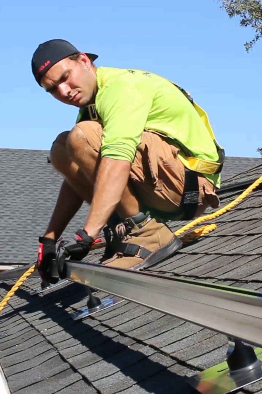 Florida solar installer on roof of Florida home installing solar panel mounts