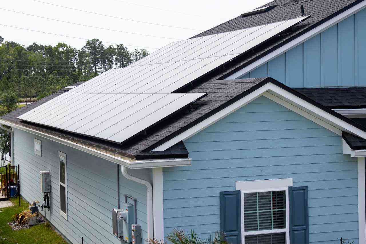 single story home in Florida with solar panels on roof