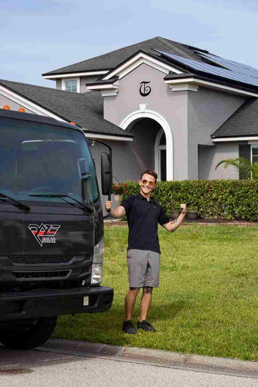 solar energy contractor outside of Florida home showing best rooftop solar panels