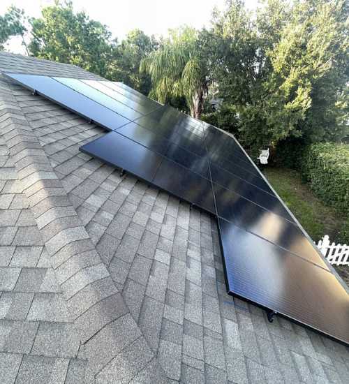 Florida home with new solar panels on roof slope