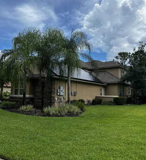 street view of Florida home with solar panels on roof