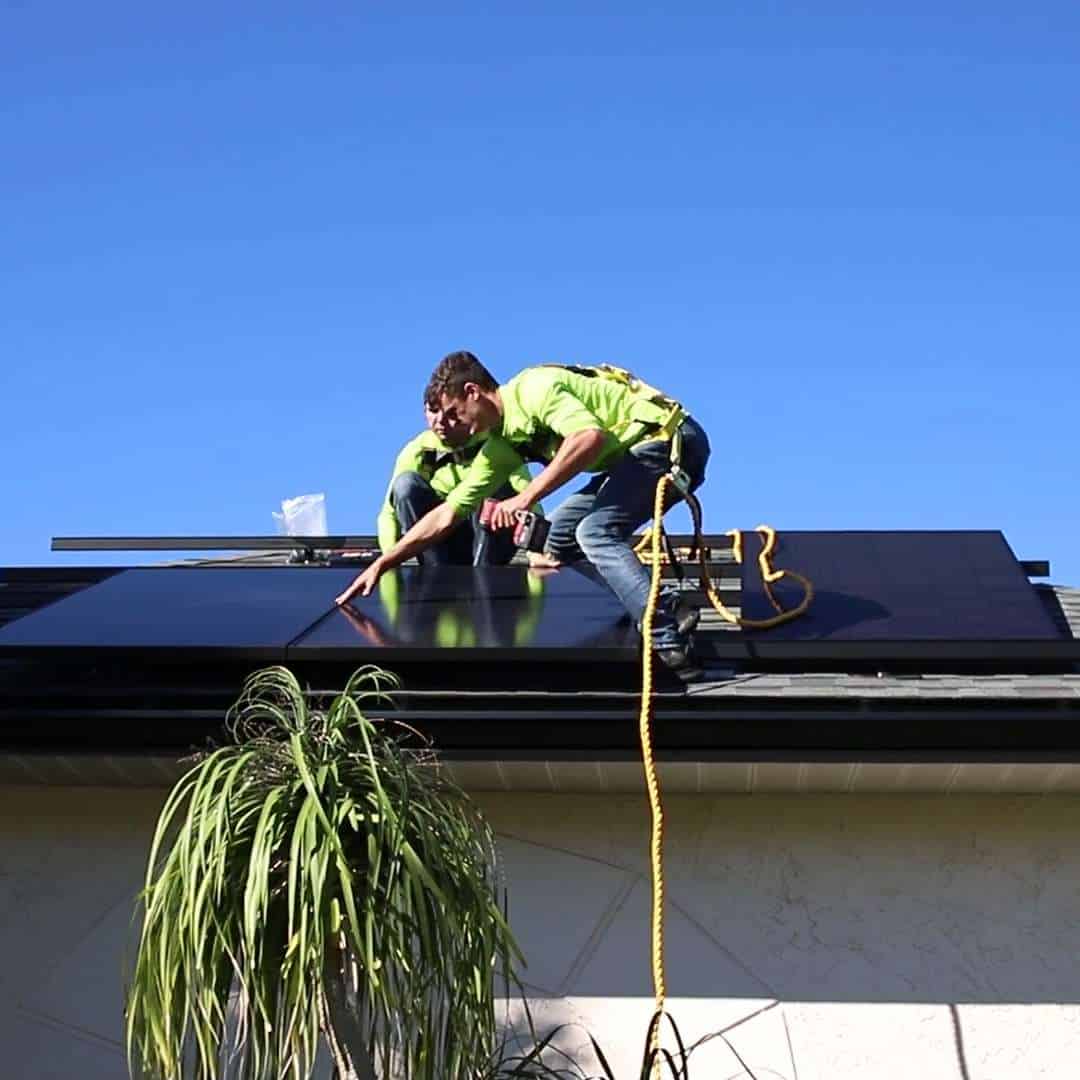 Florida solar installer working on roof to install new solar panel system