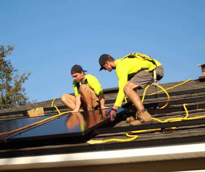 Middleburg FL solar energy company installing solar panels on residential roof