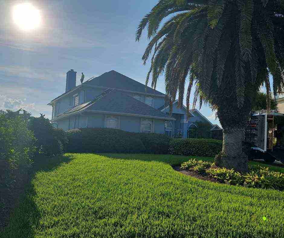 installer on roof of solar panel installation in Vilano Beach